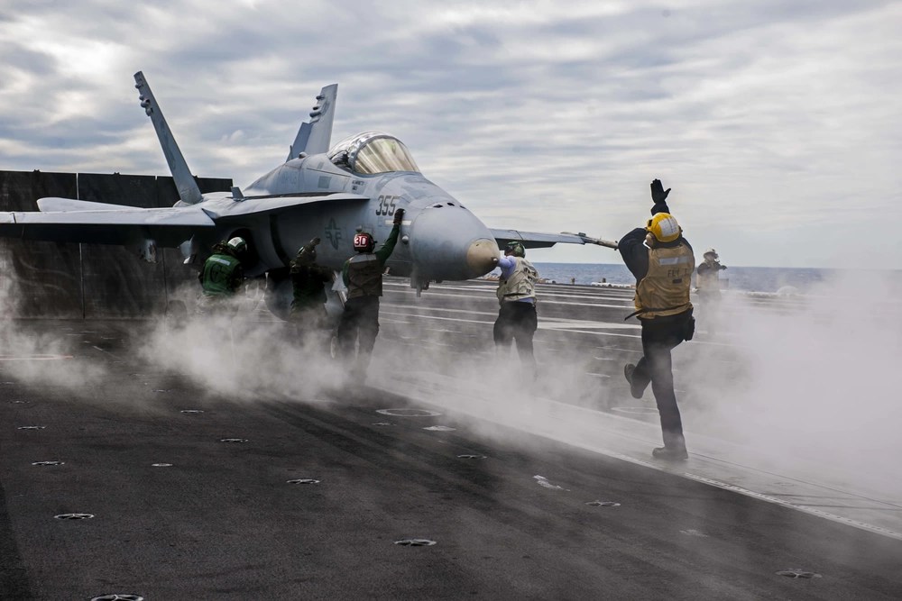 An F-18 prepared to launch from the flight deck